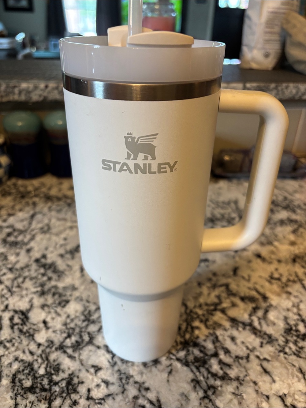 Stanley White Travel Mug with Handle and Straw with some scratches pictured.